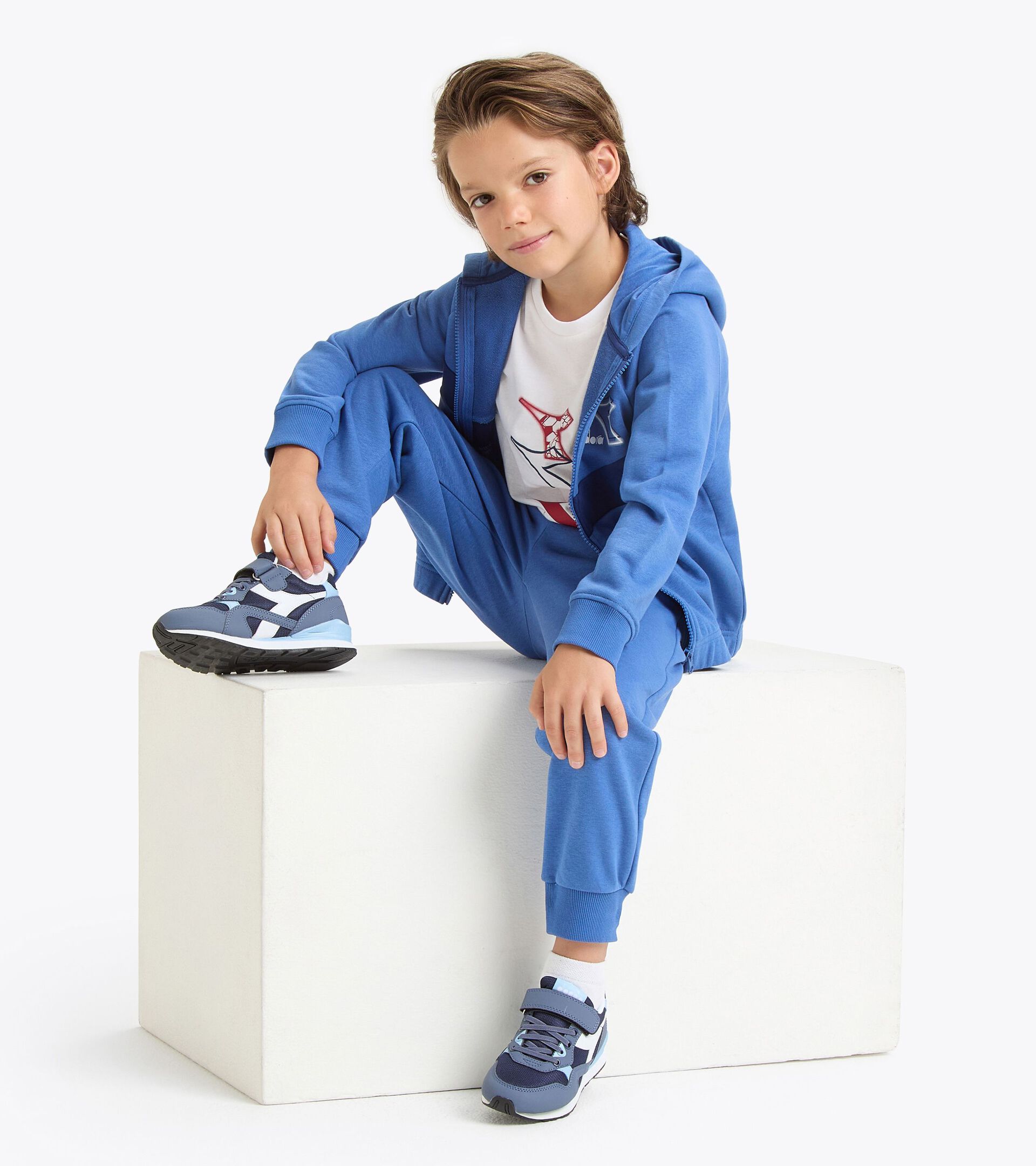 Coordinated tracksuit - Boys and girls 
 JU. TRACKSUIT HD FZ LOGO BLUE BYZANTINE - Diadora